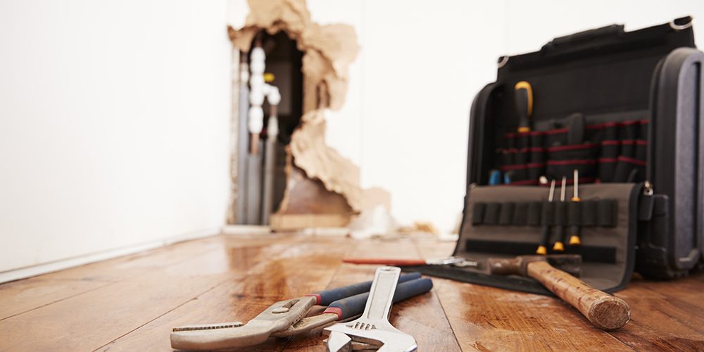 tools lying on a damaged floor