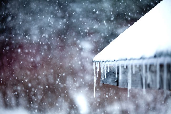 Icicles and Snowstorm close up of icicles on roof