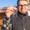 man holding key to new home